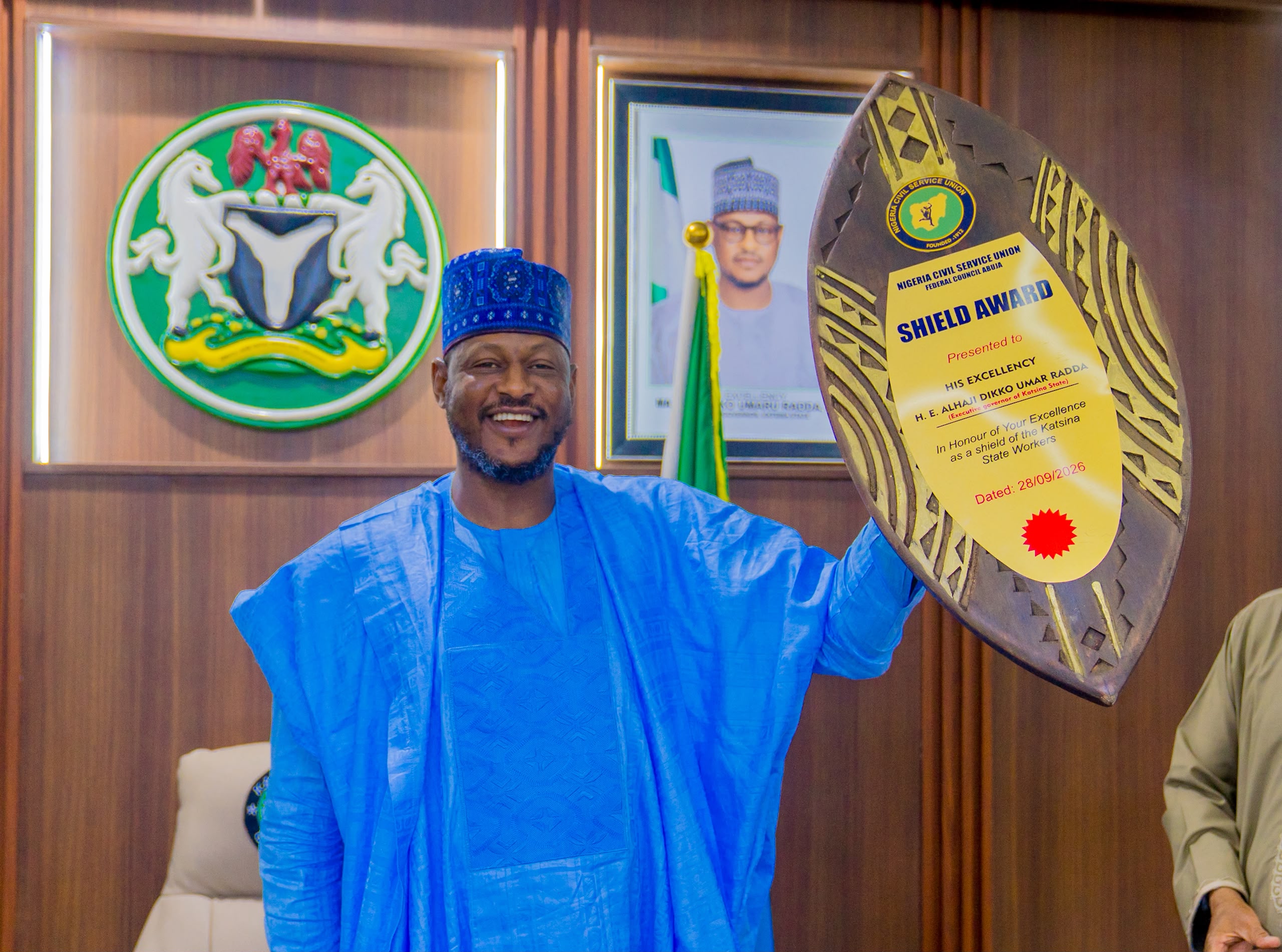 NEWS FLASH:     NCSU Honours Governor Radda With Workers Shield Award
